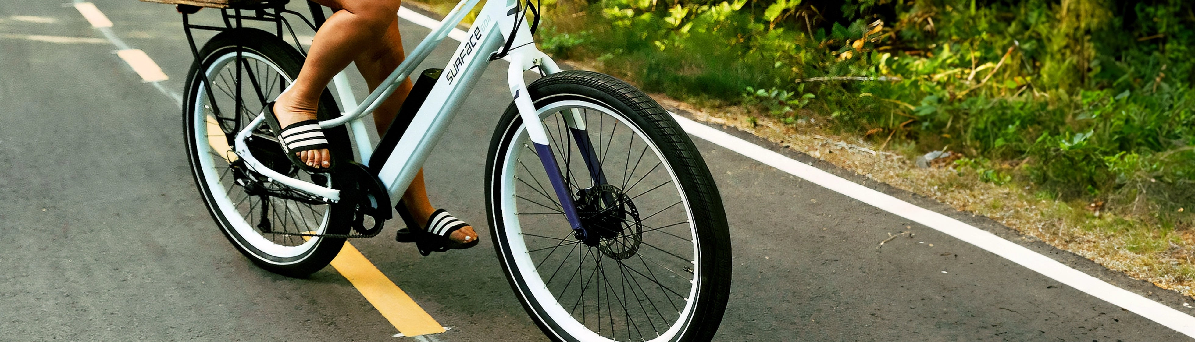 Person riding Surface 604 eBike on bike path 