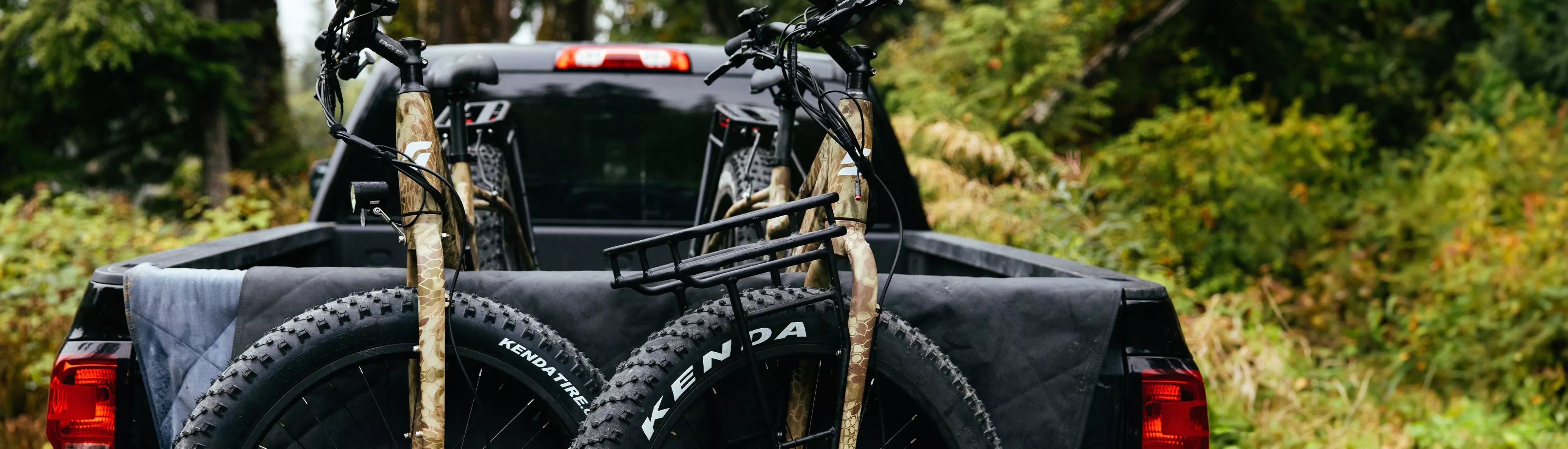 Two Surface 604 Boar Hunter eBikes strapped onto hunters truck