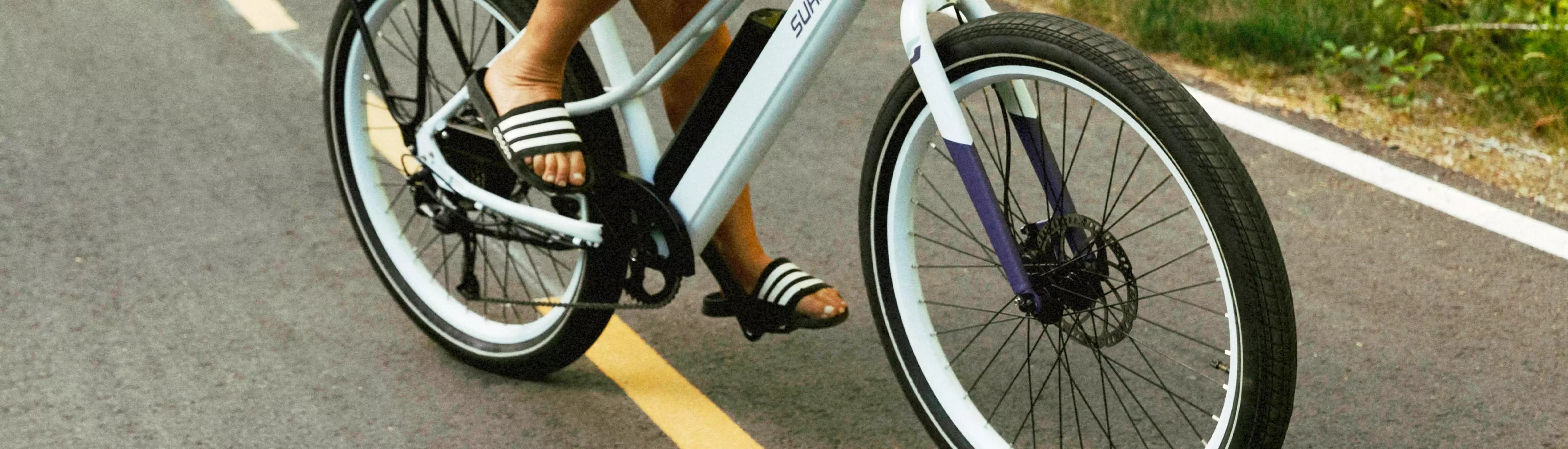 Person riding Surface 604 eBike on pavement 