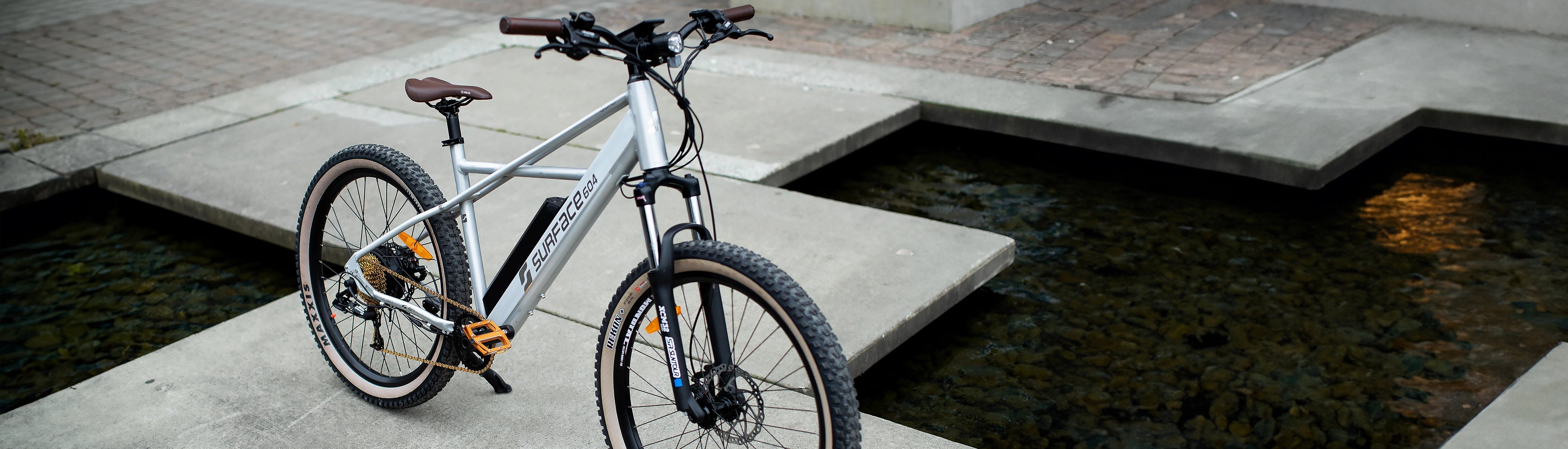 Surface 604 Step-Over eBike parked on concrete 