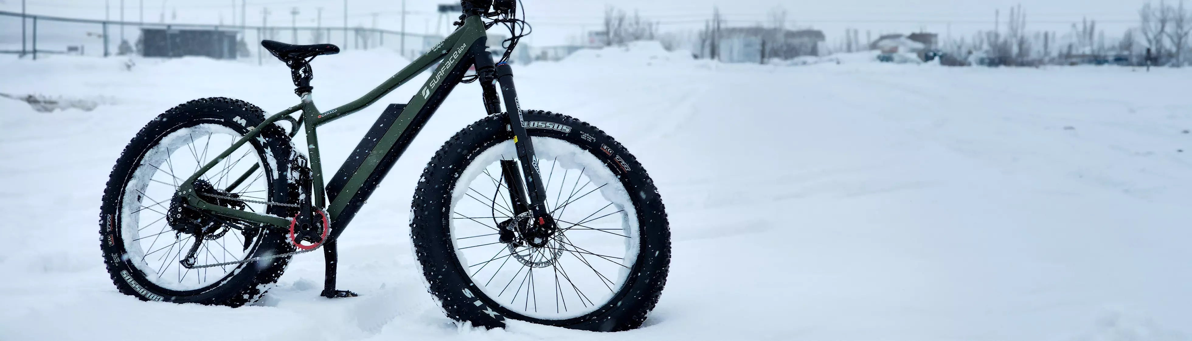 Surface604 fat tire eBike parked in snow during winter months